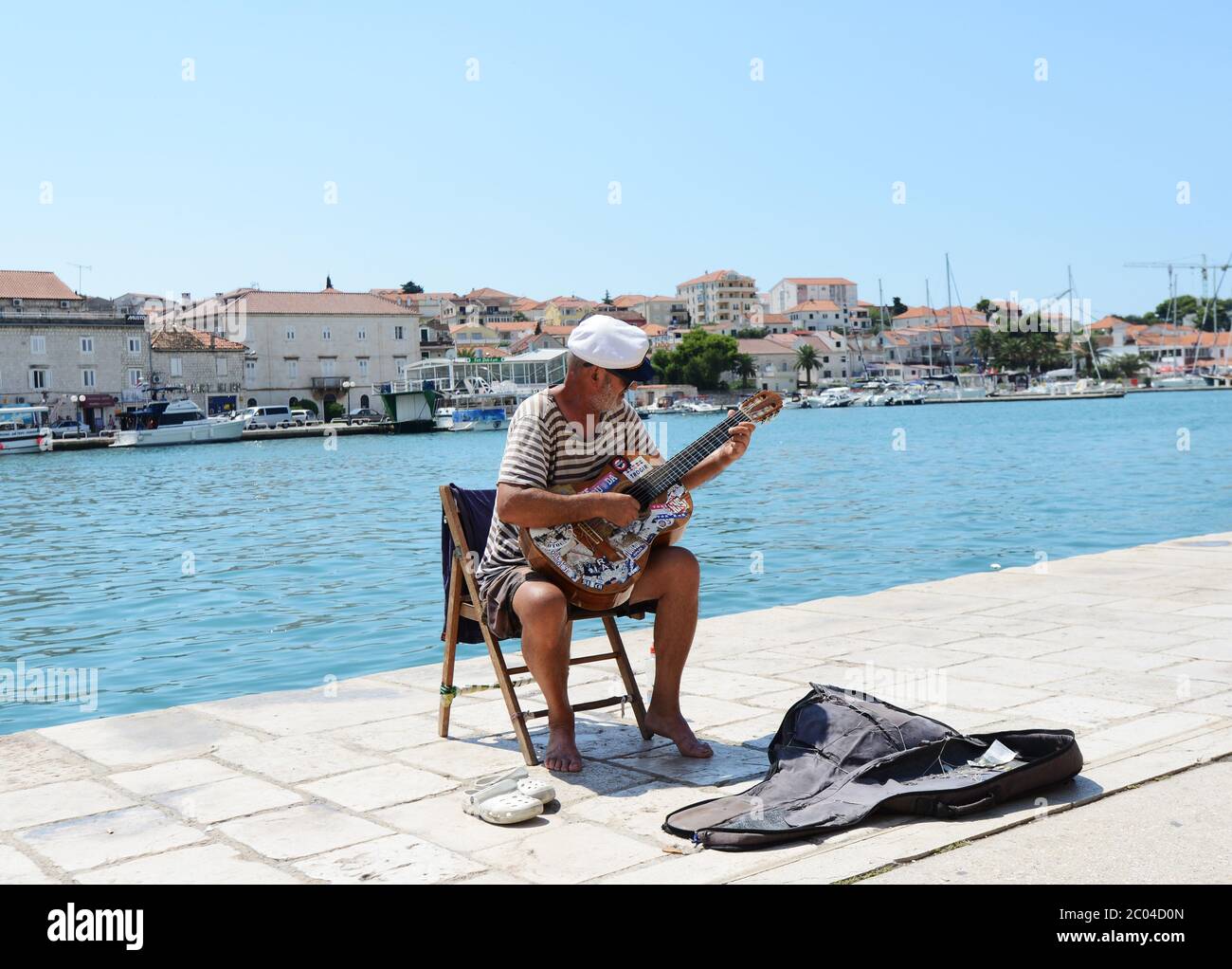 A local busker in Trogir, Croatia. Stock Photo