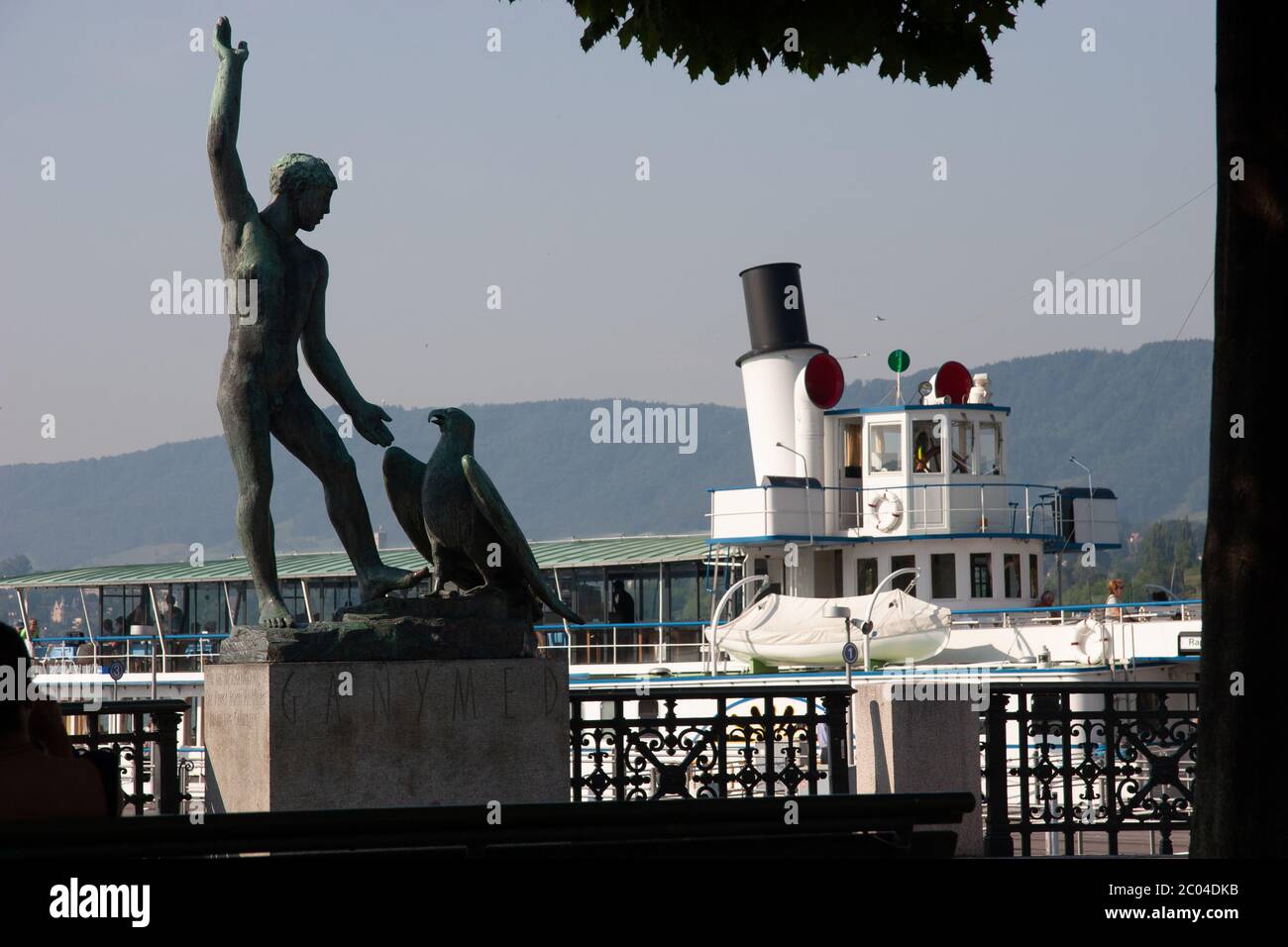 Stadt Rapperswil paddle steamer at Burkliplatz with statue of Ganymede in foreground Stock Photo