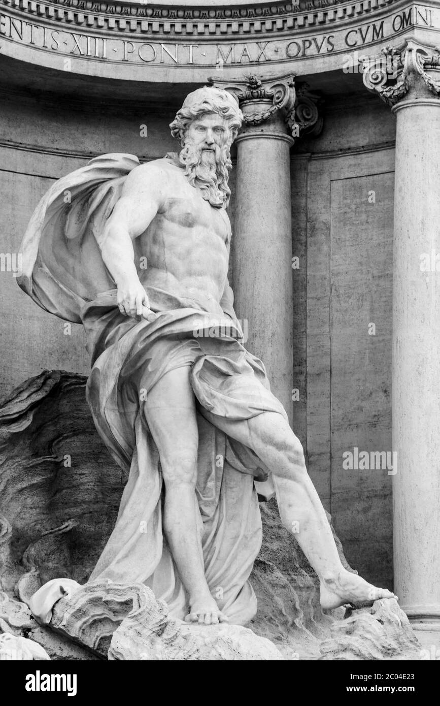 White marble statue of Oceanus, part of Trevi Fountain, Rome, Italy. Black and white image. Stock Photo