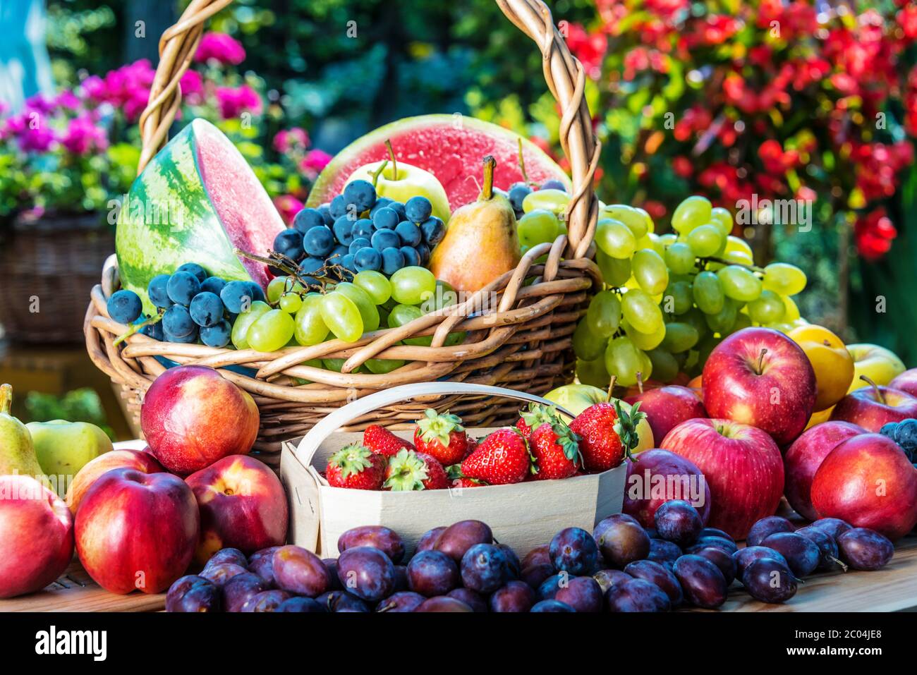 Variety of fresh ripe fruits in the garden. Balanced diet Stock Photo ...