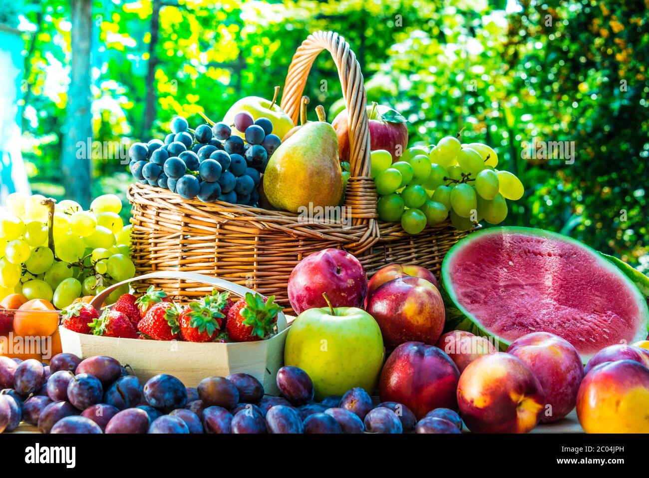 Variety of fresh ripe fruits in the garden. Balanced diet Stock Photo ...