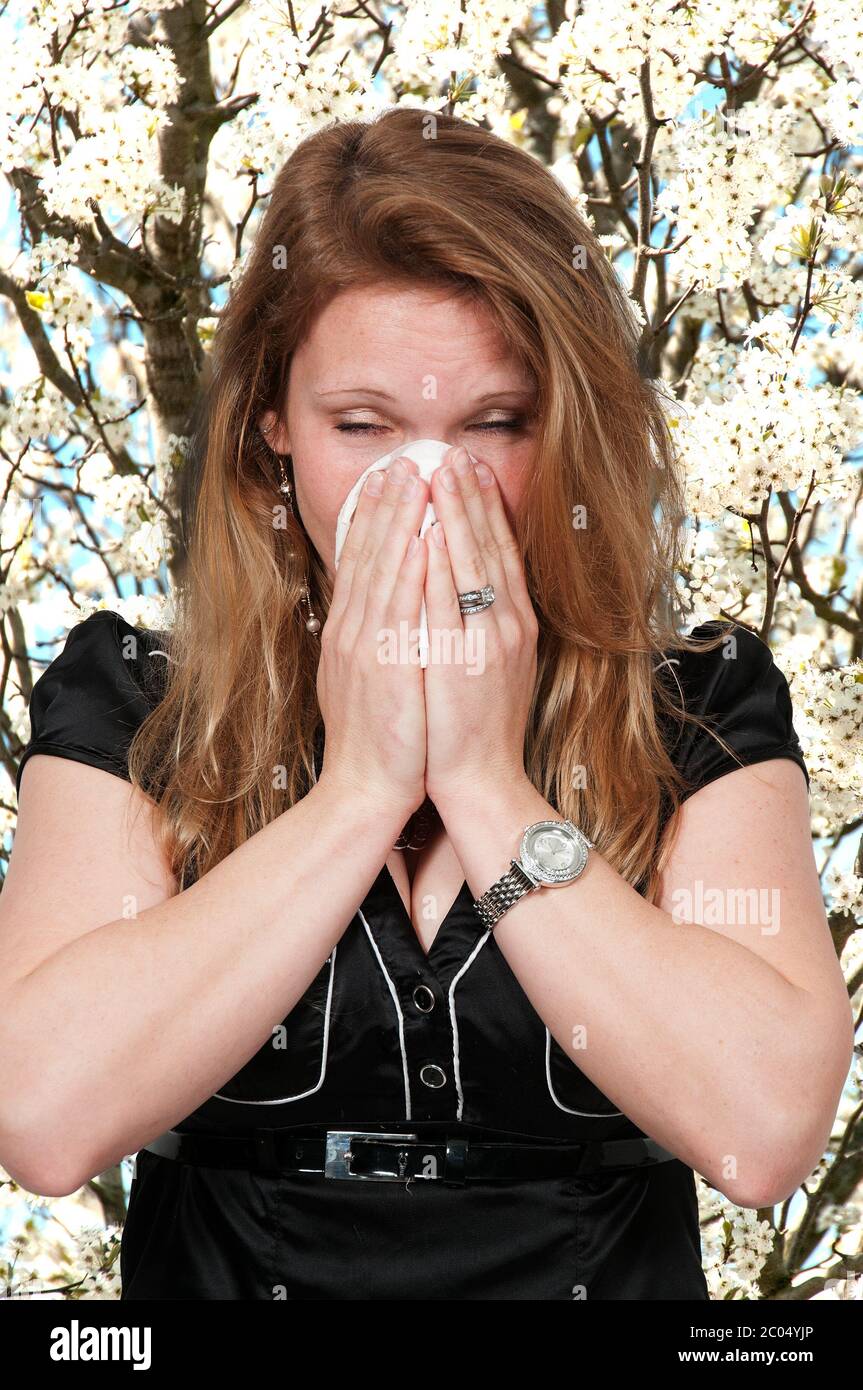 Woman Blowing Her Nose Stock Photo
