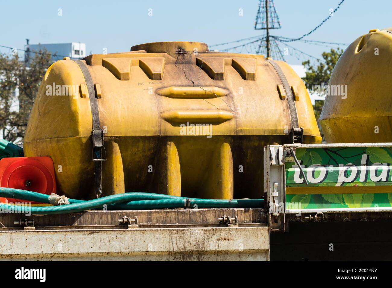 water bowser or tank delivering non potable water for garden irrigation during drought conditions in South Africa Stock Photo