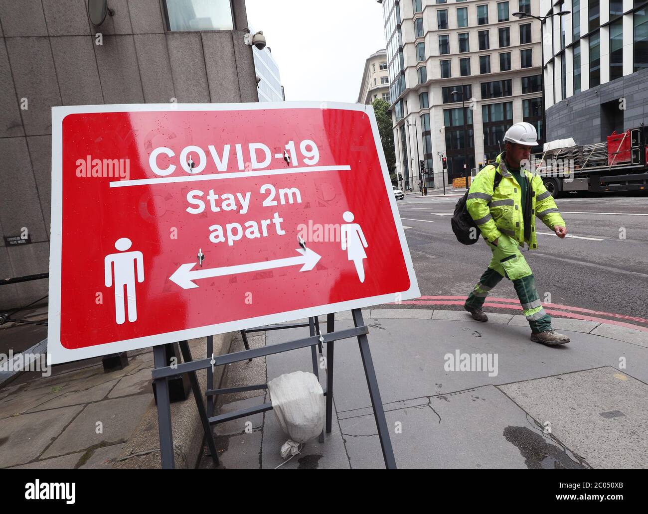 Signage related to social distancing and Covid-19 on display in London ...