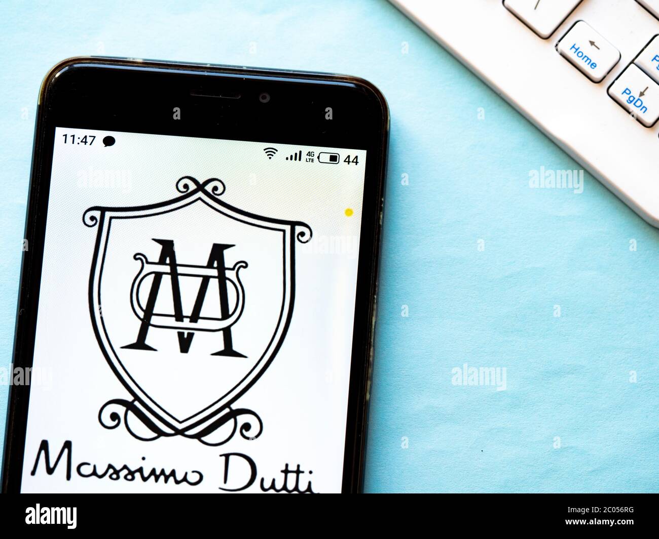 In this photo illustration e-commerce Massimo Dutti logo is seen displayed  on a smartphone Stock Photo - Alamy