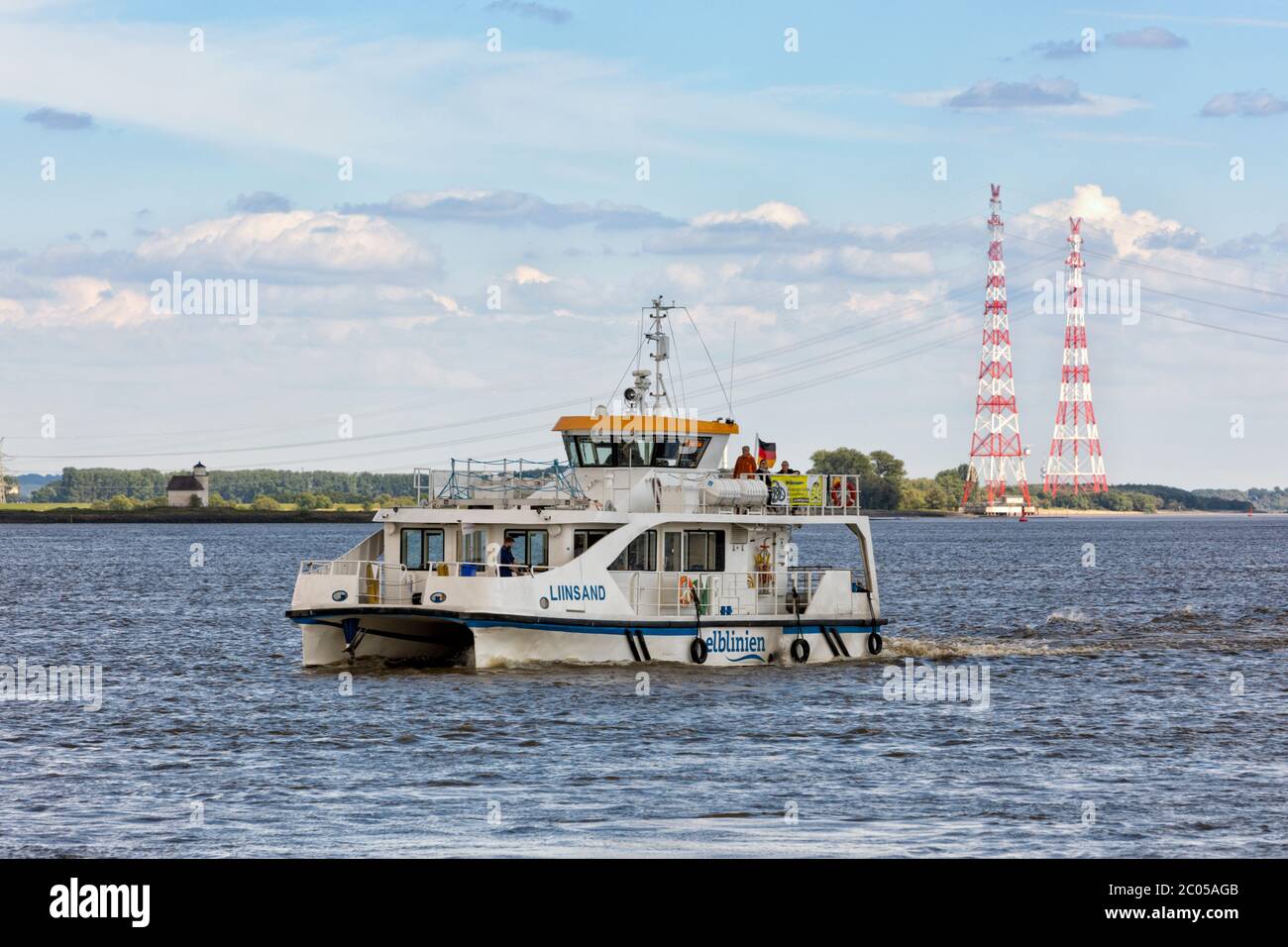 Catamaran ferry boat LIINSAND on Elbe river approaching Stade Stock Photo