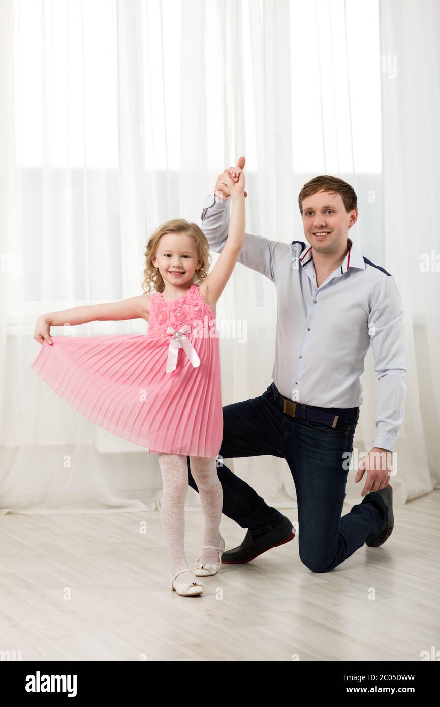 Little princess dancing with father Stock Photo