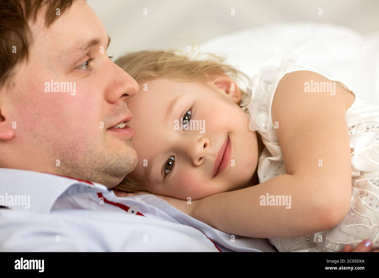 Lovely girl close to beloved father Stock Photo