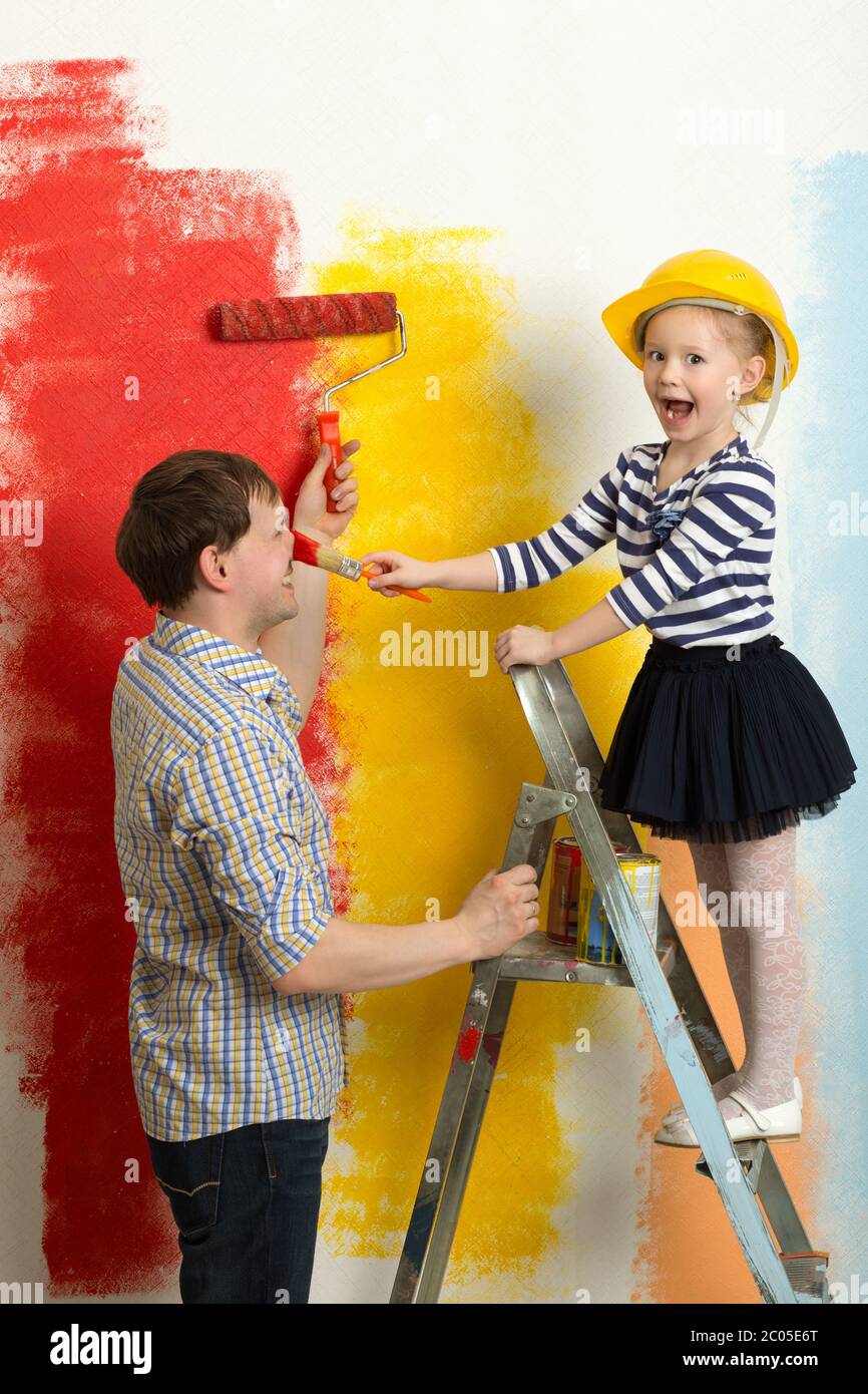 Family fun during wall painting Stock Photo