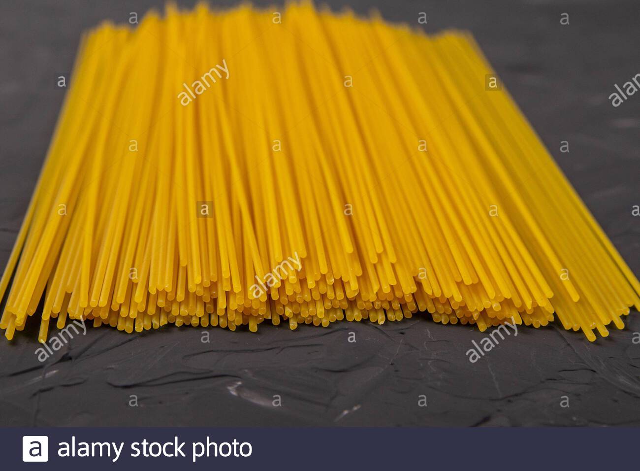 Download Yellow Long Spaghetti On A Dark Background Front Views Stock Photo Alamy Yellowimages Mockups