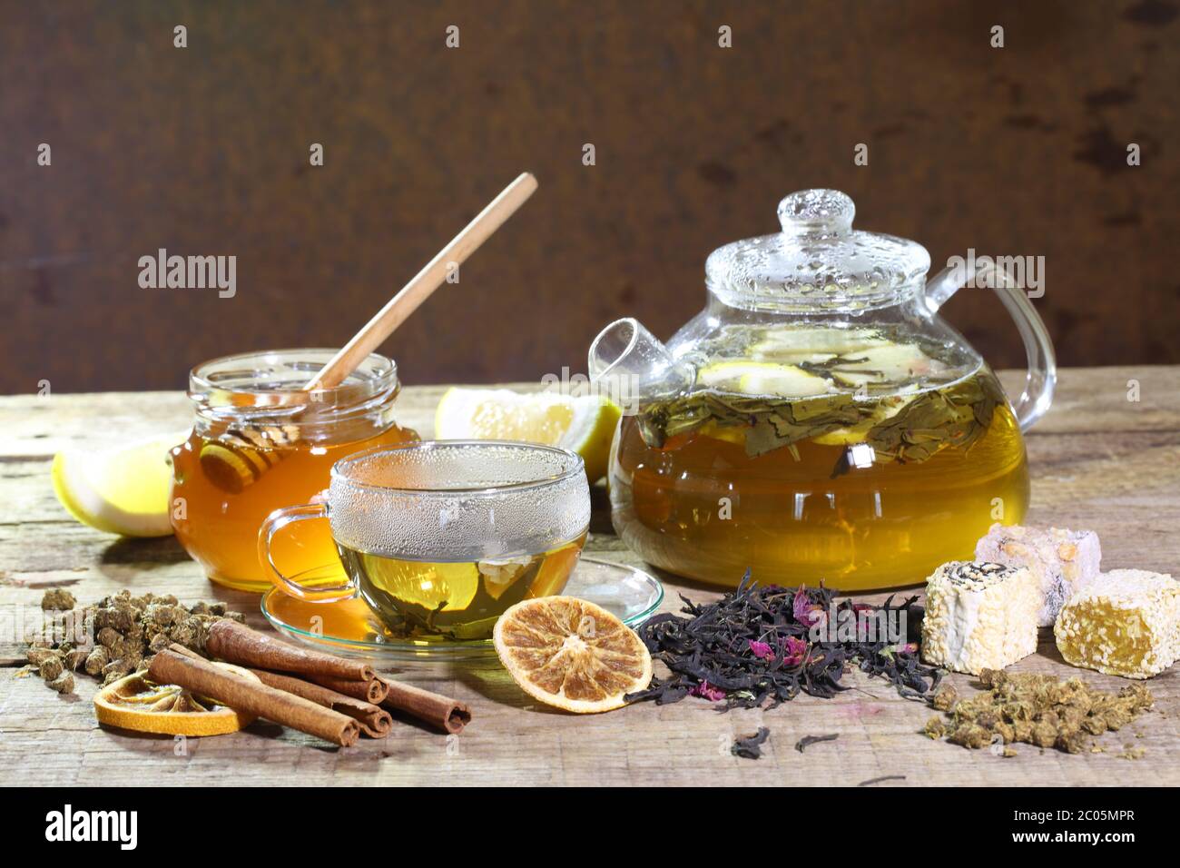 Teapot with green tea and honey in transparent bank Stock Photo