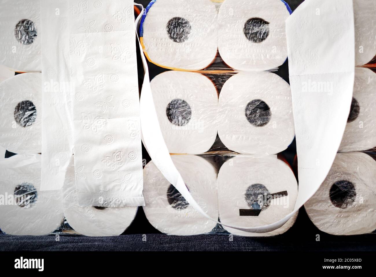 A large stack of white paper rolls packages. Illustration for webseite