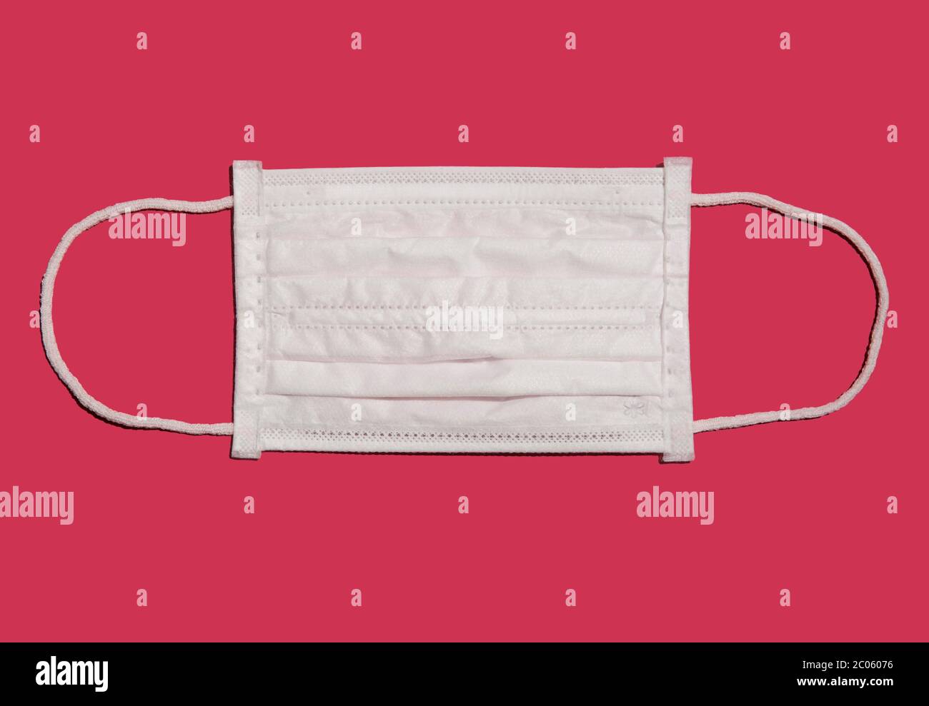 White face mask, breathing mask, pink background, Germany Stock Photo