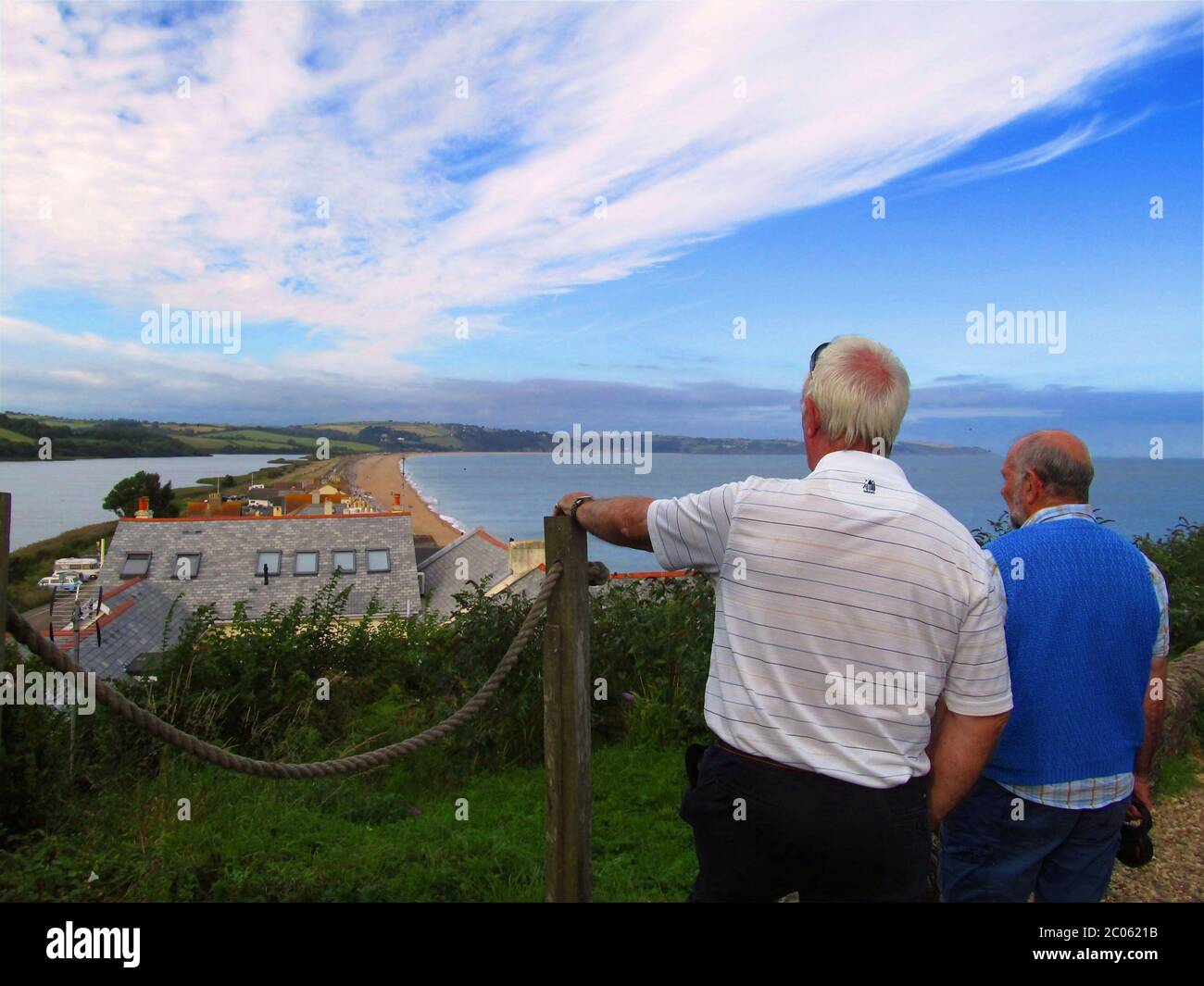 Men looking out to the sea Stock Photo - Alamy