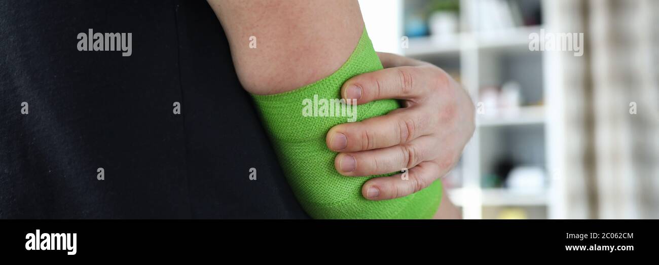 Man injured arm at work, help for persons wound Stock Photo