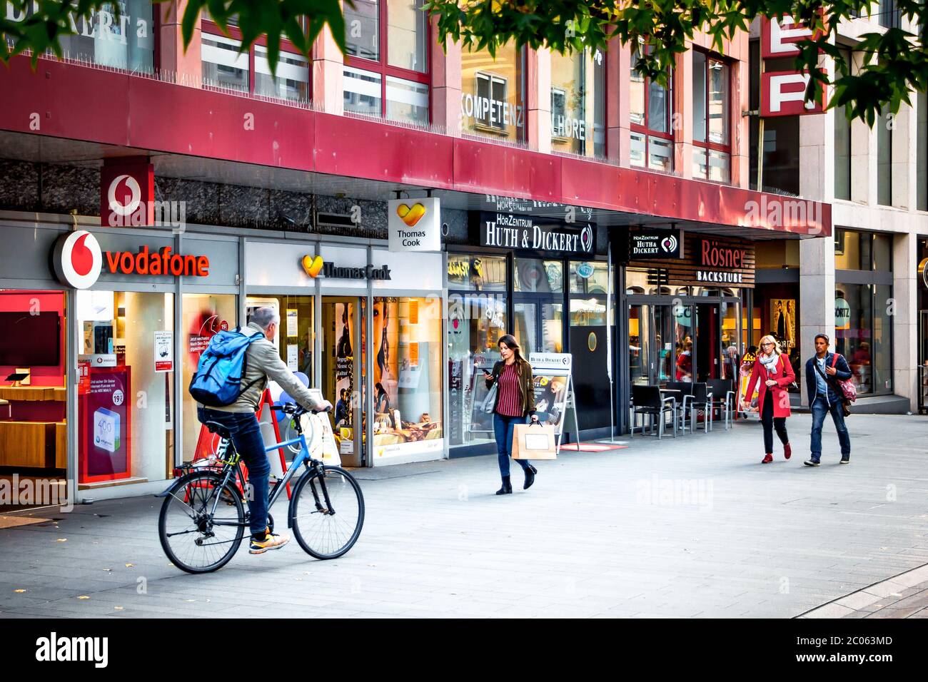 People walking down the Eichhorn street. On the background is the shopwindow of the famous travel agents and holiday specialists Thomas Cook. Stock Photo