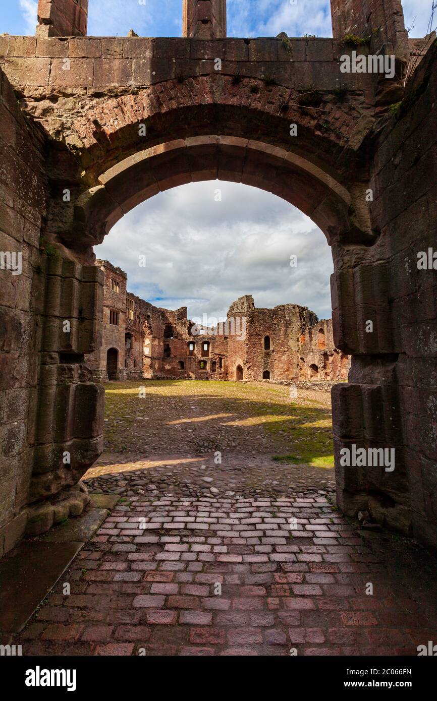 Through the Main Gatehouse arch of Raglan Castle into the Stone Pitched Court, Wales Stock Photo