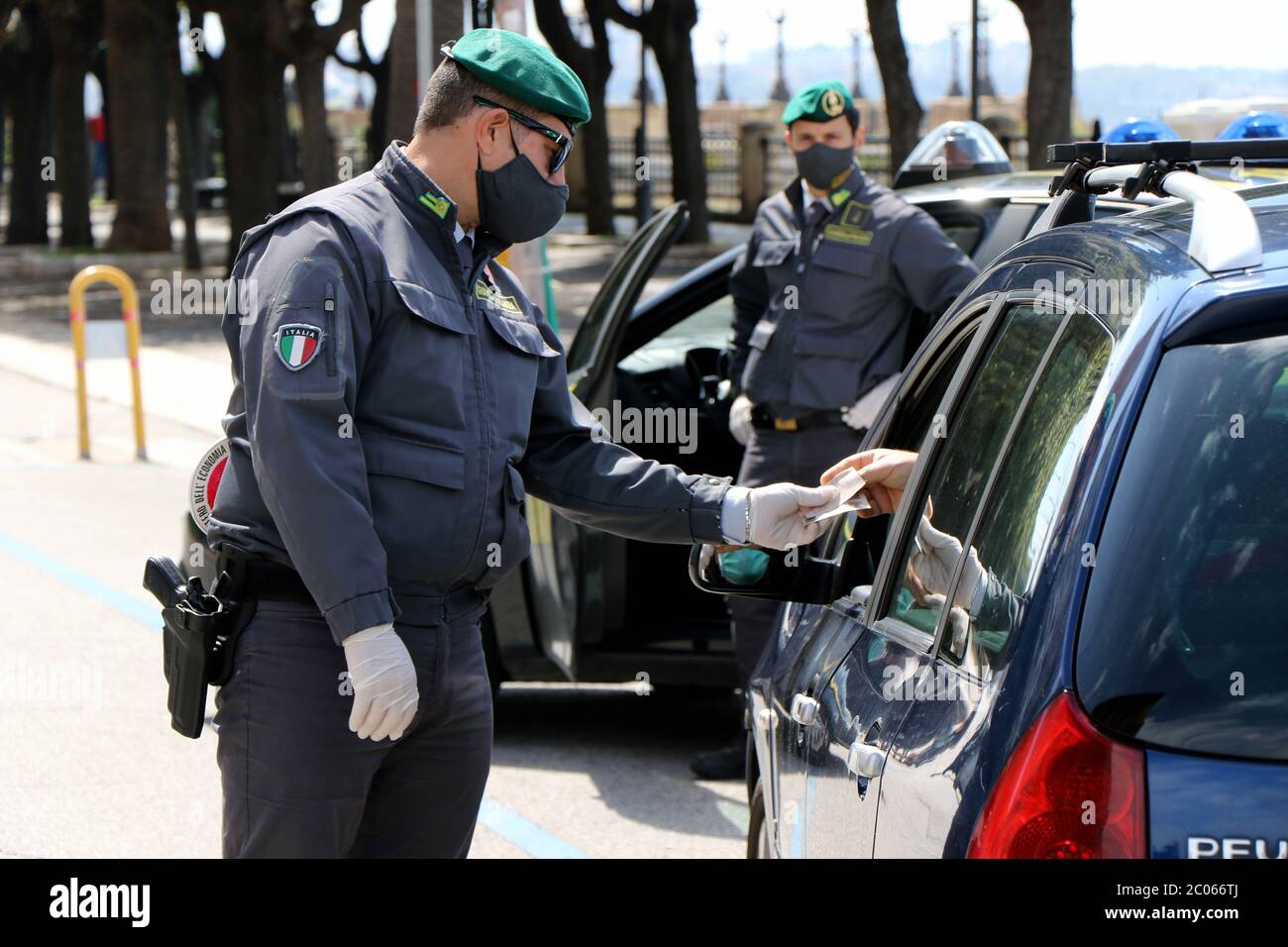 Italian Guardia di Finanza with protective masks due to Coronavirus during  a checkpoint in Puglia, Italy Stock Photo - Alamy