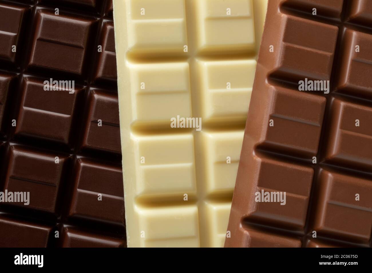 Whole bar of white, dark and milk chocolate close up full frame Stock Photo