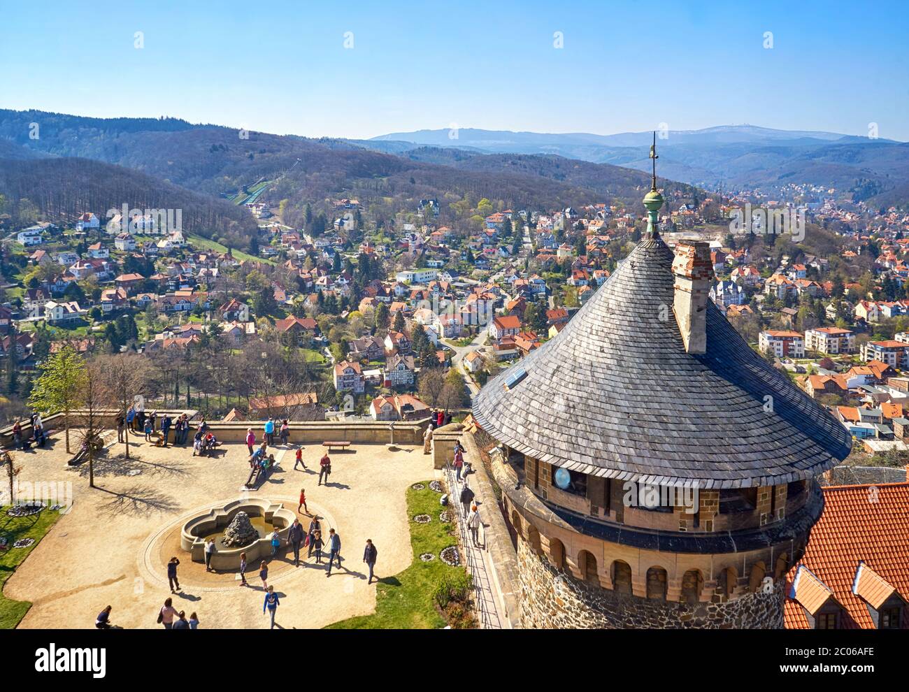 View of the courtyard with tower at Wernigerode Castle with the Harz Mountains and the city in the background. Germany Stock Photo
