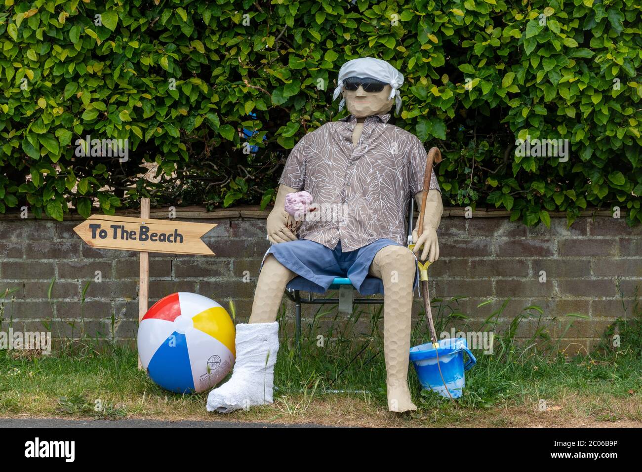 Scarecrow trail or festival, part of Old Basing carnival celebrations, Hampshire, UK. Scarecrow dressed for the beach. Stock Photo