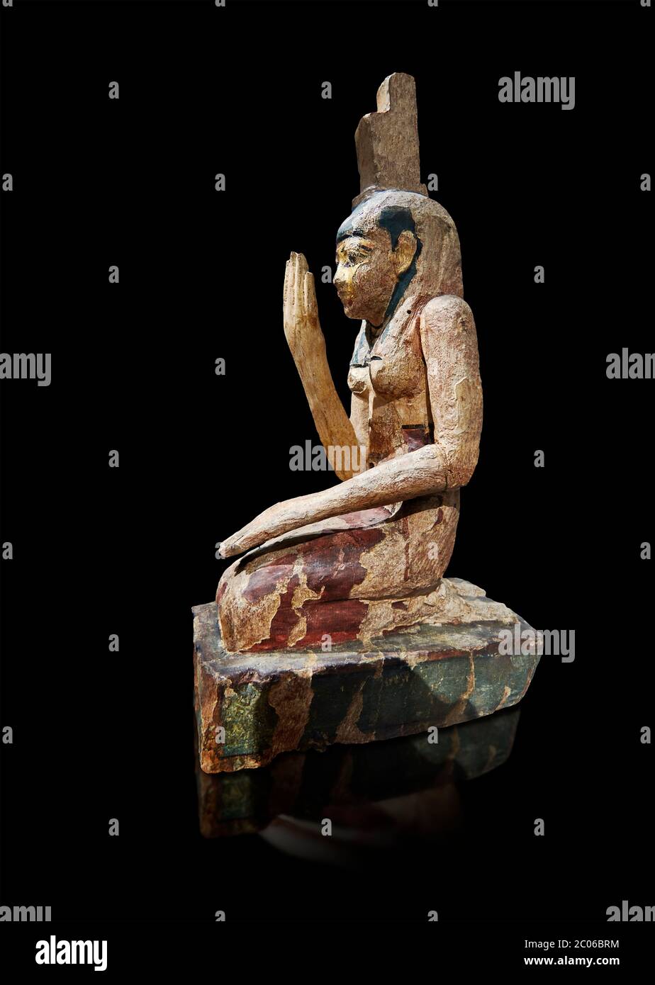 Ancient Egyptian wooden statue of osiris weeping, Late Period (664-332 BC). Egyptian Museum, Turin. Drovetti Cat 203.  Grey background. Stock Photo