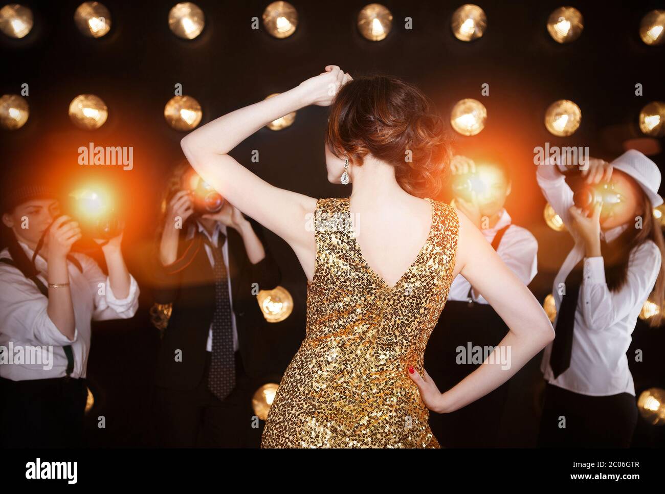 Superstar woman posing to paparazzi Stock Photo - Alamy