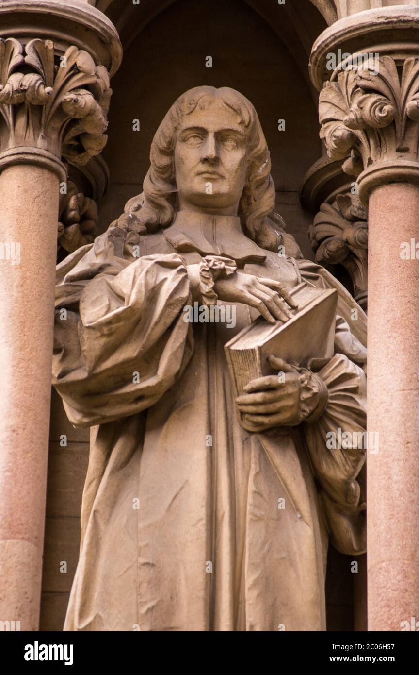 Statue of the former Bishop of Worcester Edward Stillingfleet (1635 - 1699). Outside the chapel of St John's College, Cambridge. Stock Photo