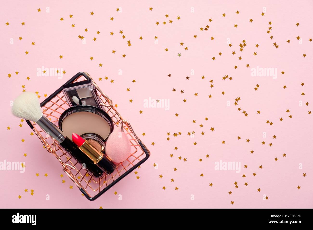 Shopping basket with make-up cosmetics on pink background with confetti.  Flat lay, top view. Beauty shop discount sale banner design Stock Photo -  Alamy