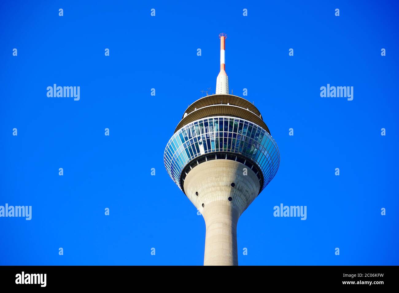 Worm's eye view of Rhine Tower (German: Rheinturm), Düsseldorf's landmark, with blue sky background. The Rhine Tower is 240.5 metres high. Stock Photo