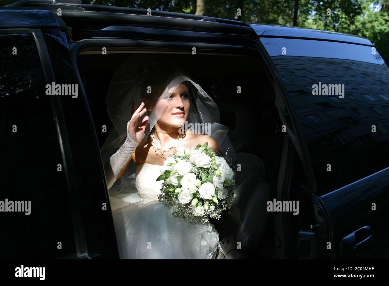 The beautiful bride in a car Stock Photo