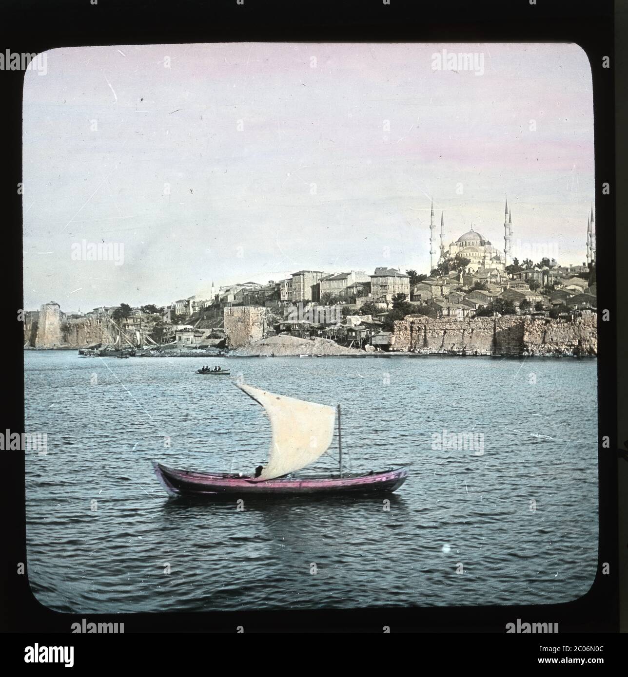 Seaside walls and city skyline with Hagia Sophia from the Marmara sea, Istanbul, Turkey. Hand colored slide from around 1910. Photograph on dry glass plate from the Herry W. Schaefer collection. Stock Photo