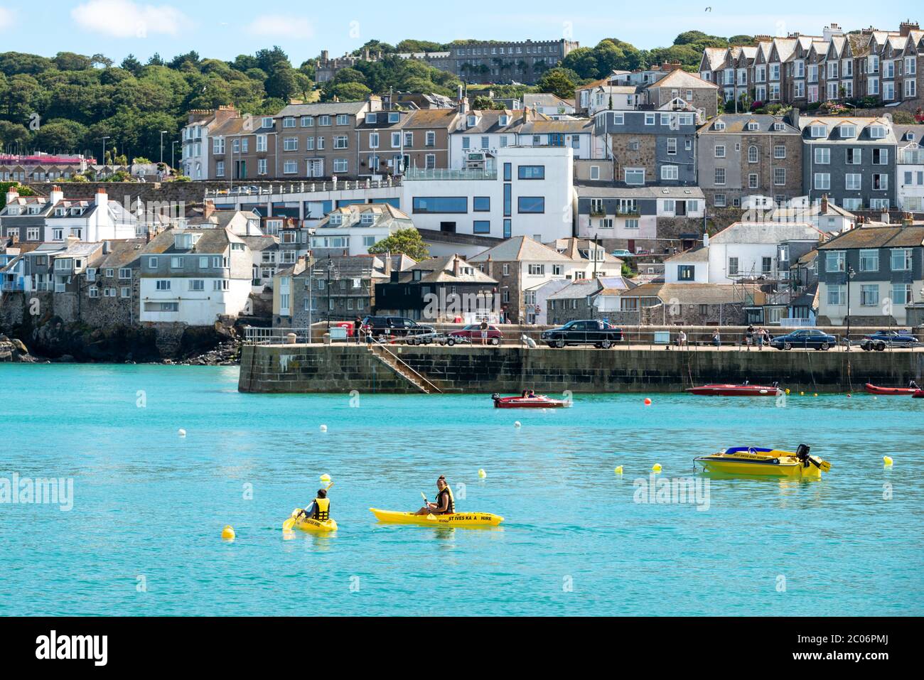 Saint Ives, Cornwall, UK. People kayaking on the sea at St Ives Harbour. Stock Photo