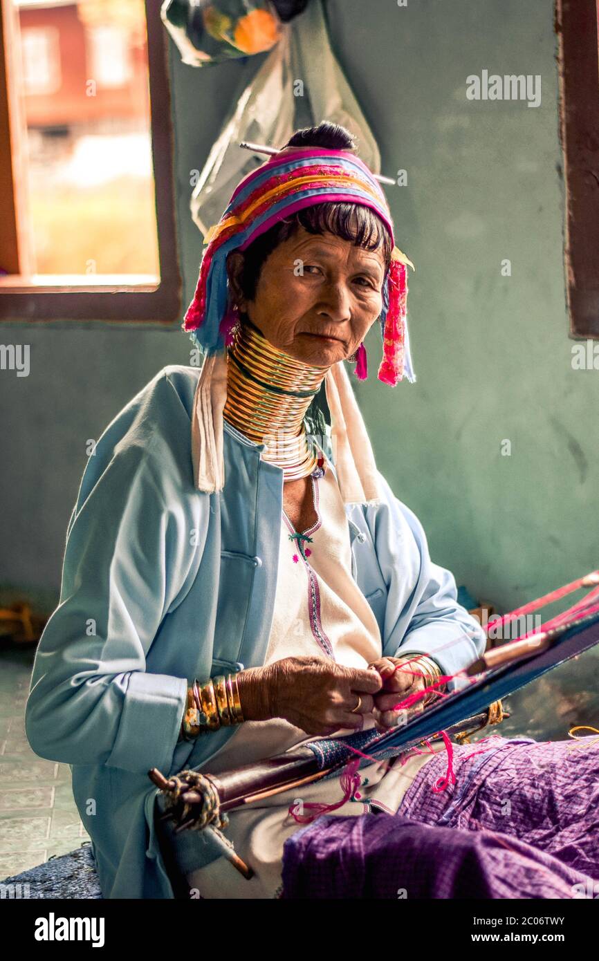 Long Neck Woman from the Kayan Tribe Working on a Loom at the Inle Lake in Myanmar Burma Stock Photo