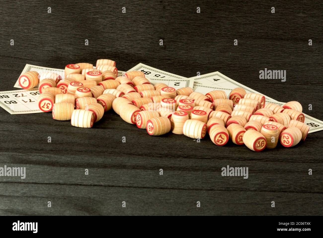 Barrels of lotto lie scattered on a black background Stock Photo