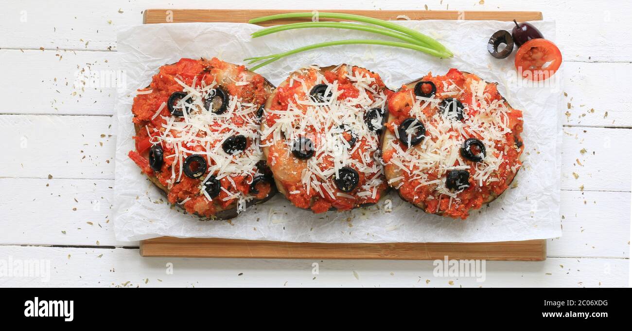 Homemade food concept. Baked eggplant au gratin with tomatoes, olives