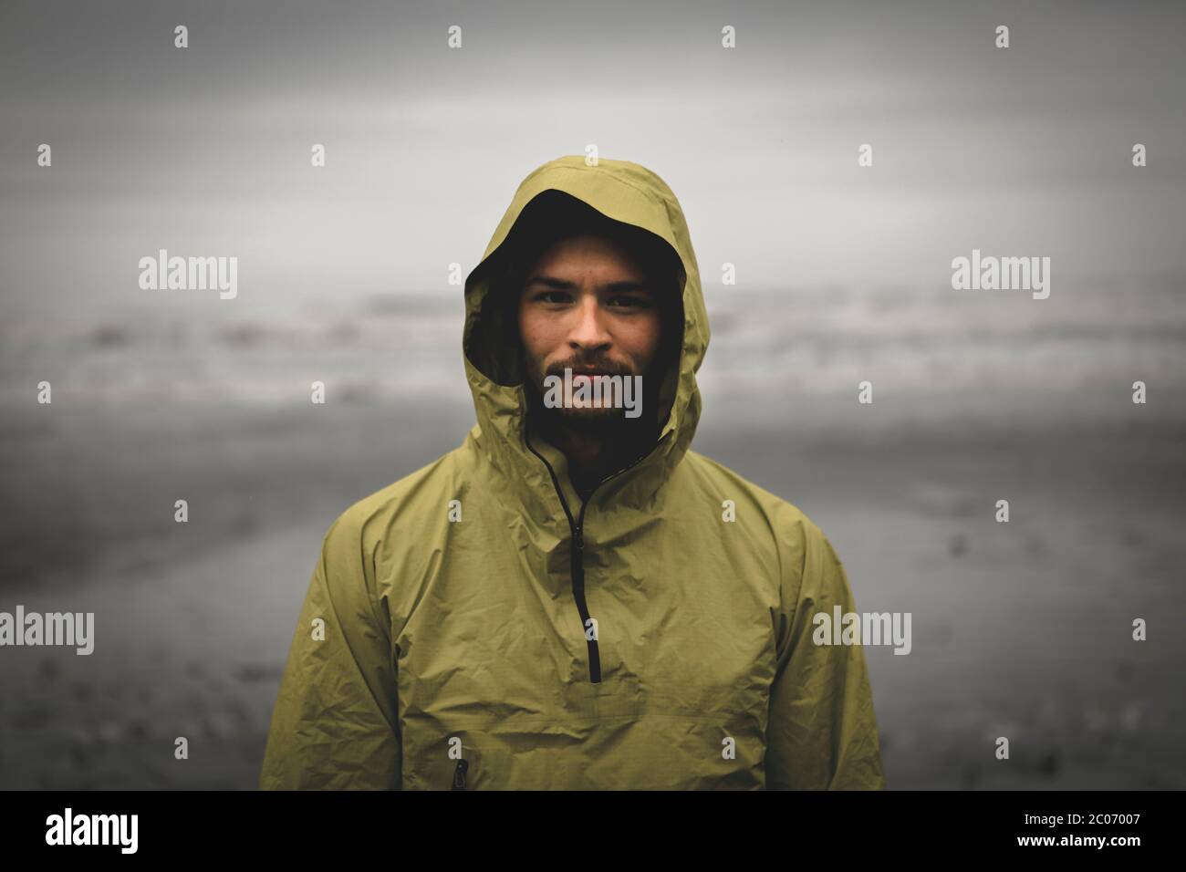 Portrait shot of adventurous looking male during bad weather Stock Photo
