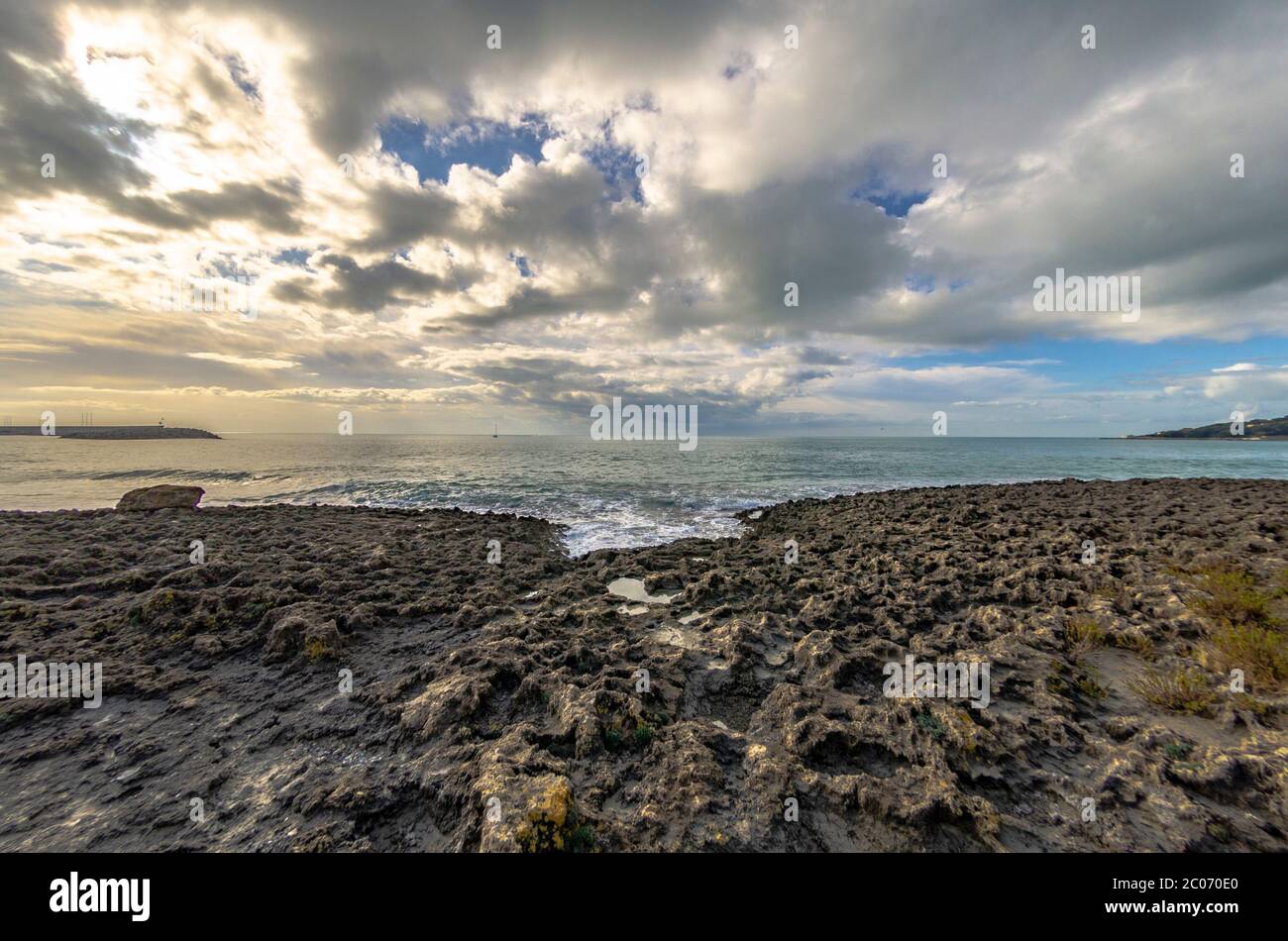 Cloudy sky over ocean sunset hi-res stock photography and images - Alamy
