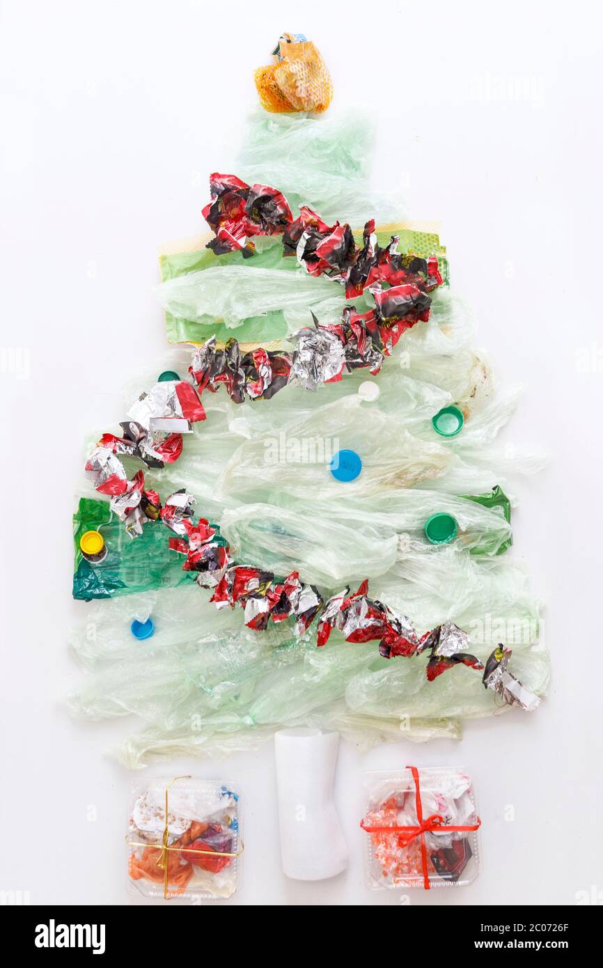 Christmas tree and gifts from plastic waste on white background