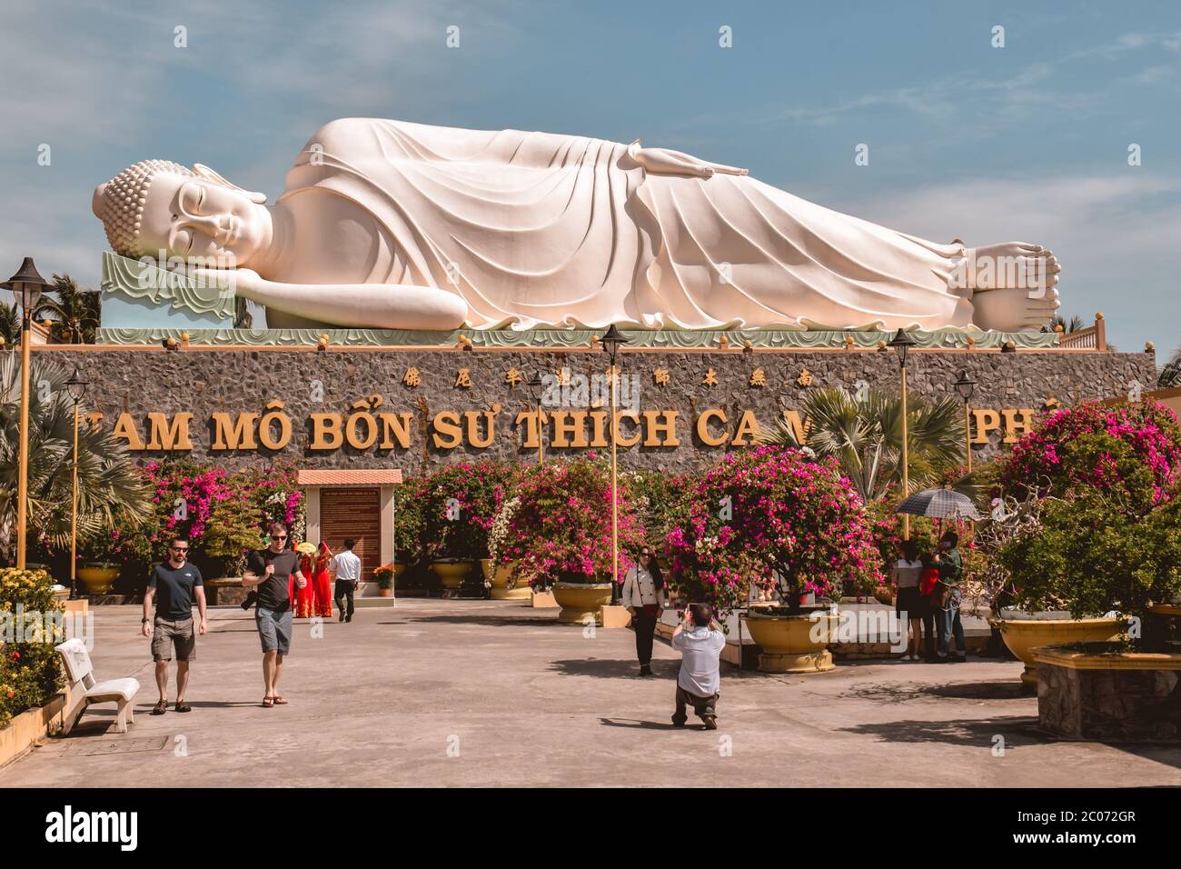 Big resting Buddha statue at the Vinh Trang pagoda in the Mekong Delta in Vietnam Stock Photo