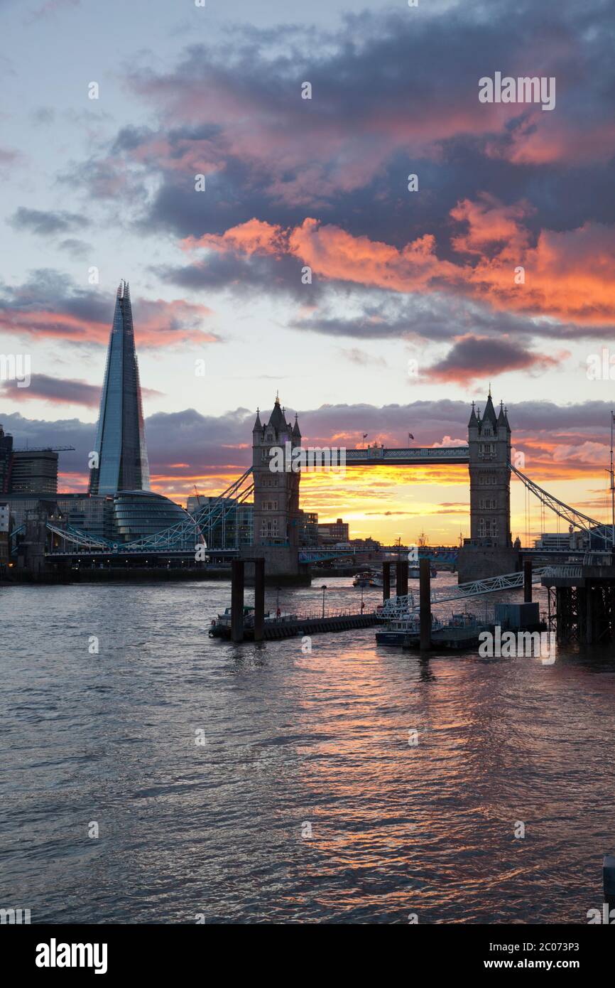 The Shard and Tower Bridge on the River Thames at sunset, London, England, UK Stock Photo