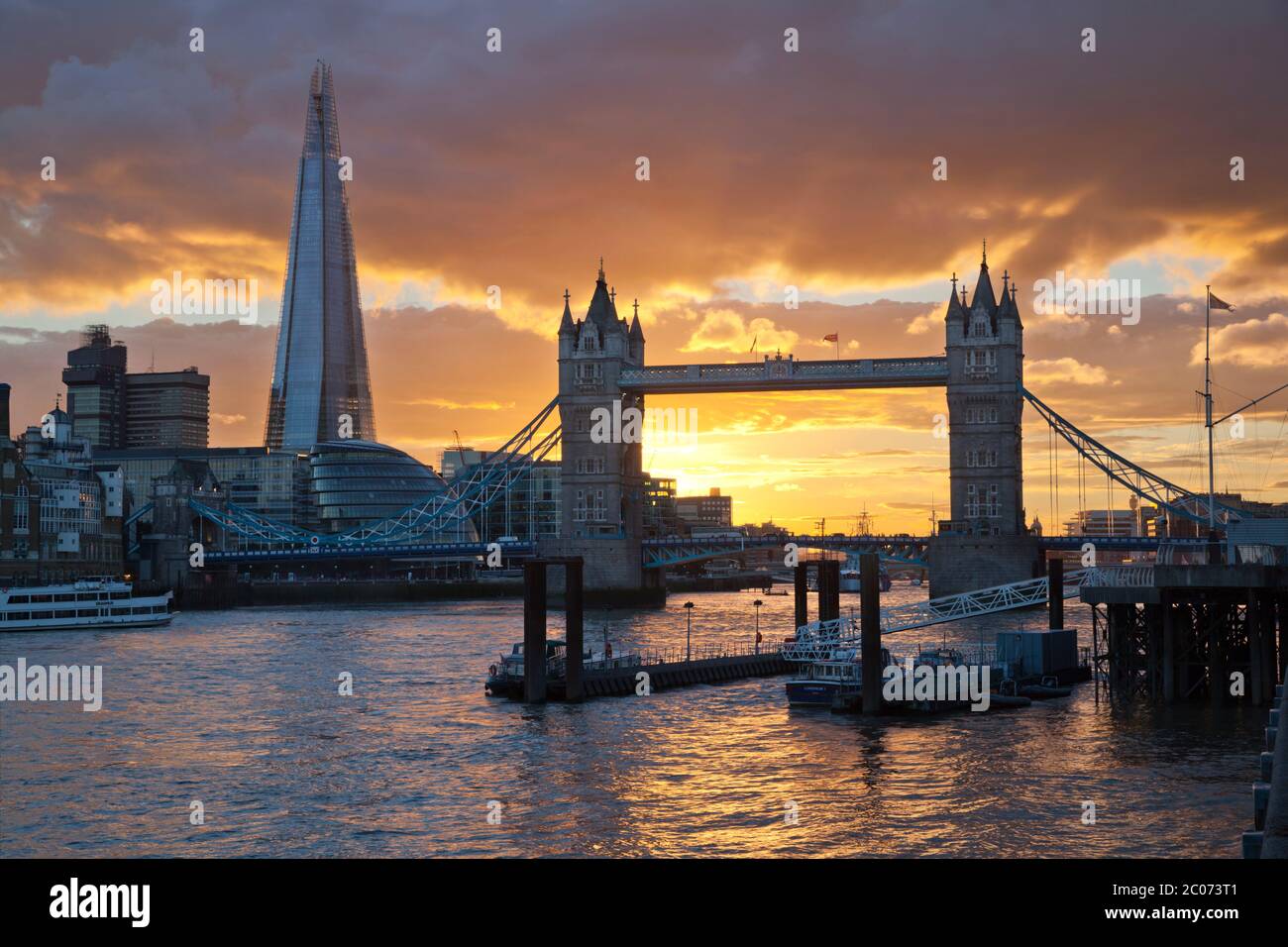 The Shard and Tower Bridge on the River Thames at sunset, London, England, UK Stock Photo