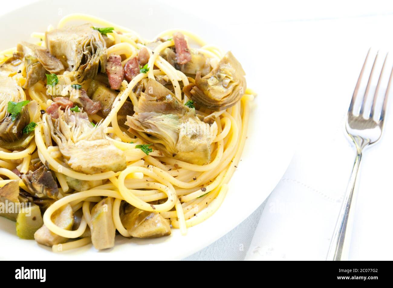 Italian Pasta with artichokes and Parmesan Stock Photo