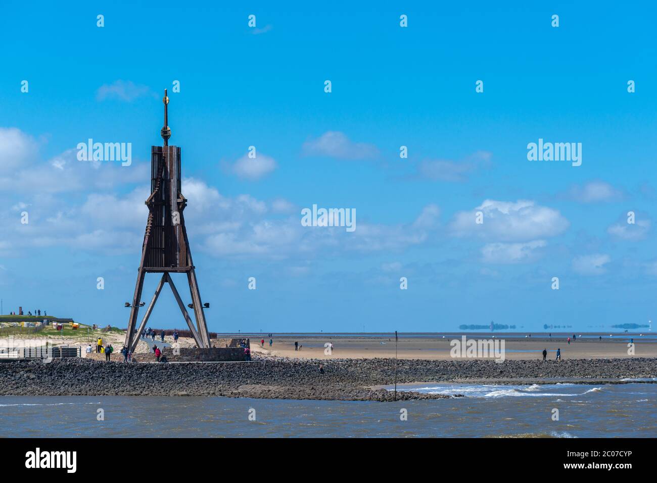 Kugelbake, a wooden seameark for ships entering the Elbe River at Cuxhaven, North Sea island of Neuwerk at the horizon, , Niedersachsen, Deutschland Stock Photo