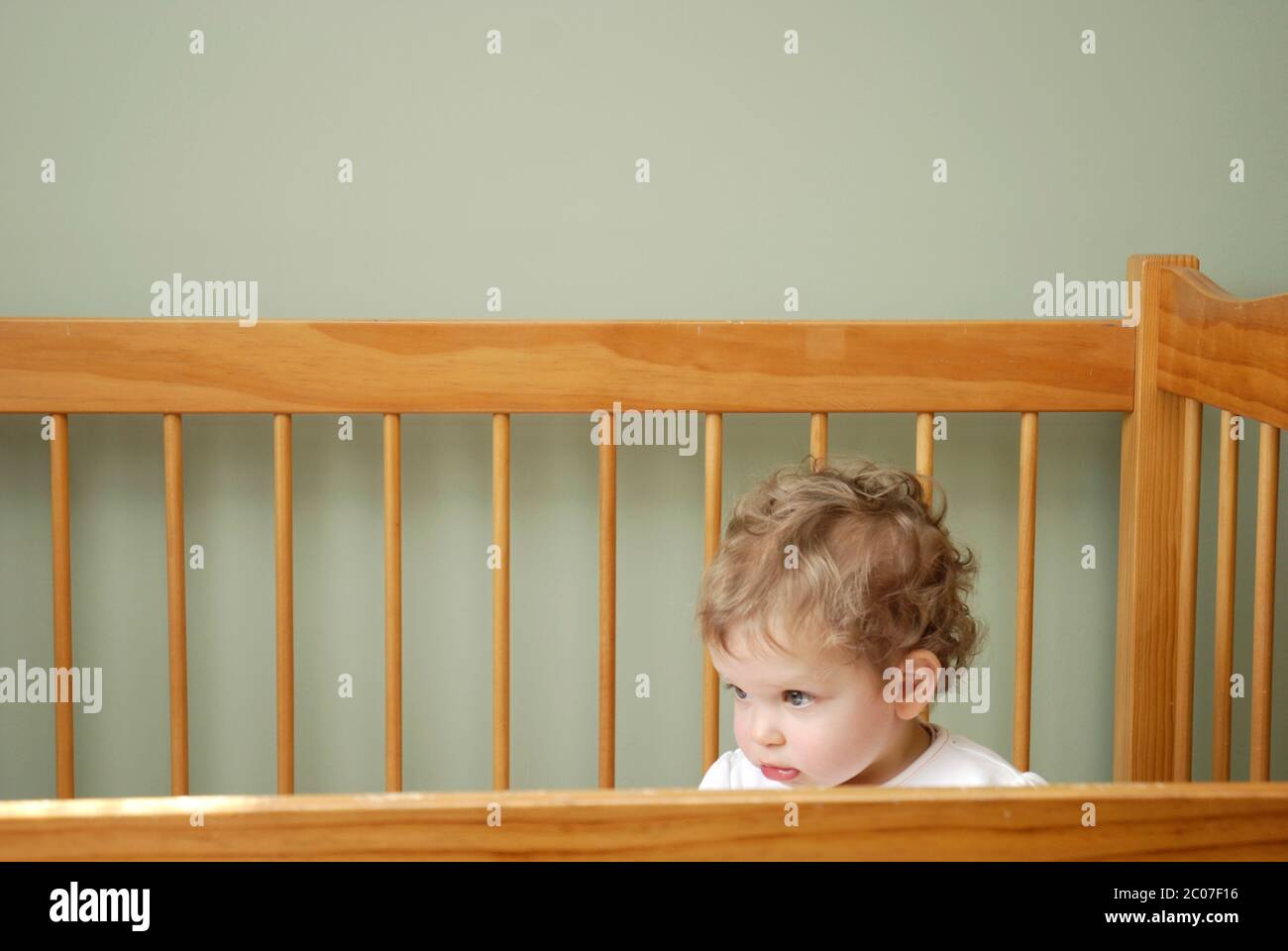 Sixteen month old child in cot Stock Photo Alamy