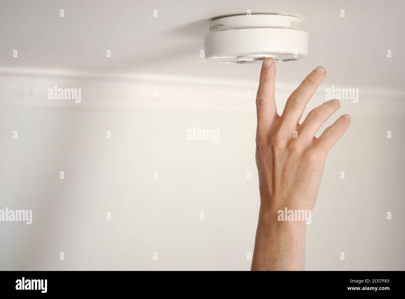 Testing smoke detector alarm battery Stock Photo Alamy