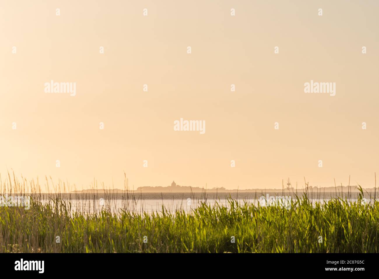 North Sea island of Neuwerk, seen from Cuxhaven-Sahlenburg on the mainland, Cuxhaven, Lower Saxony, North Germany, Unesco World Heritage Stock Photo