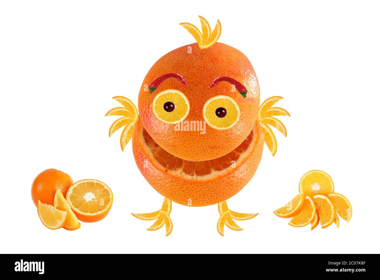 Little funny laughing orange, like chicken, standing near Oranges Stock Photo
