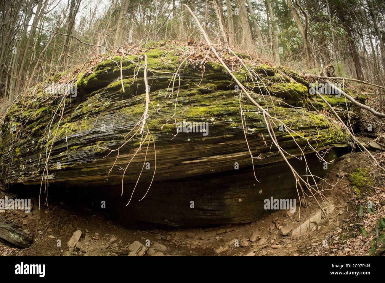 Large boulder protruding from the mountainside Stock Photo Alamy