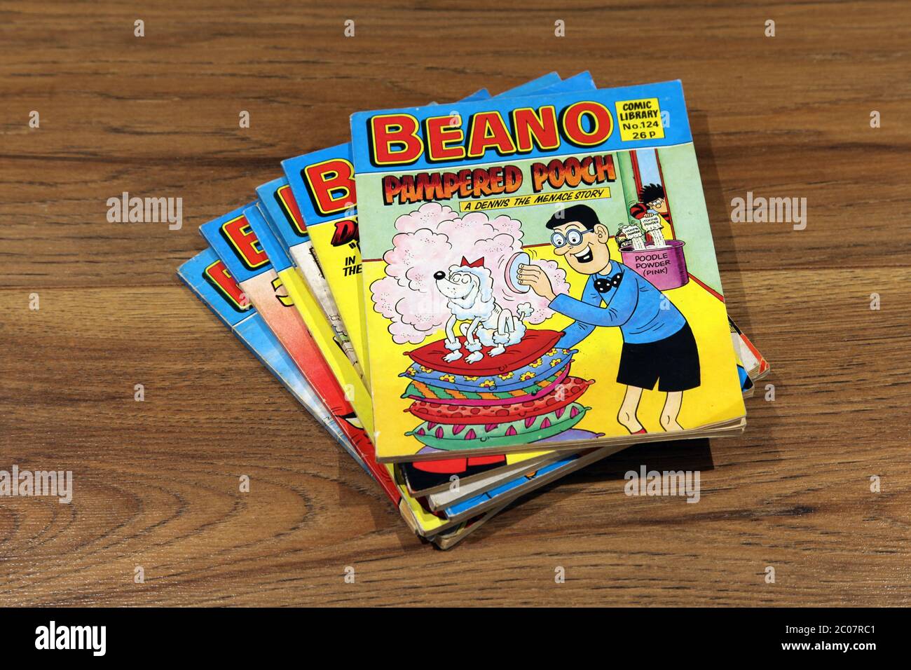 Beano Comic Library No.124 1987 'Pampered Pooch, A Dennis the Menace Story' stacked in a pile of Beano comics Stock Photo